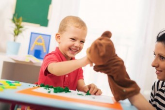 child with puppet