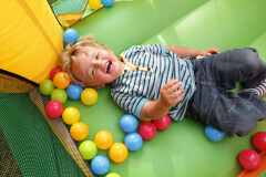 boy in ball pit